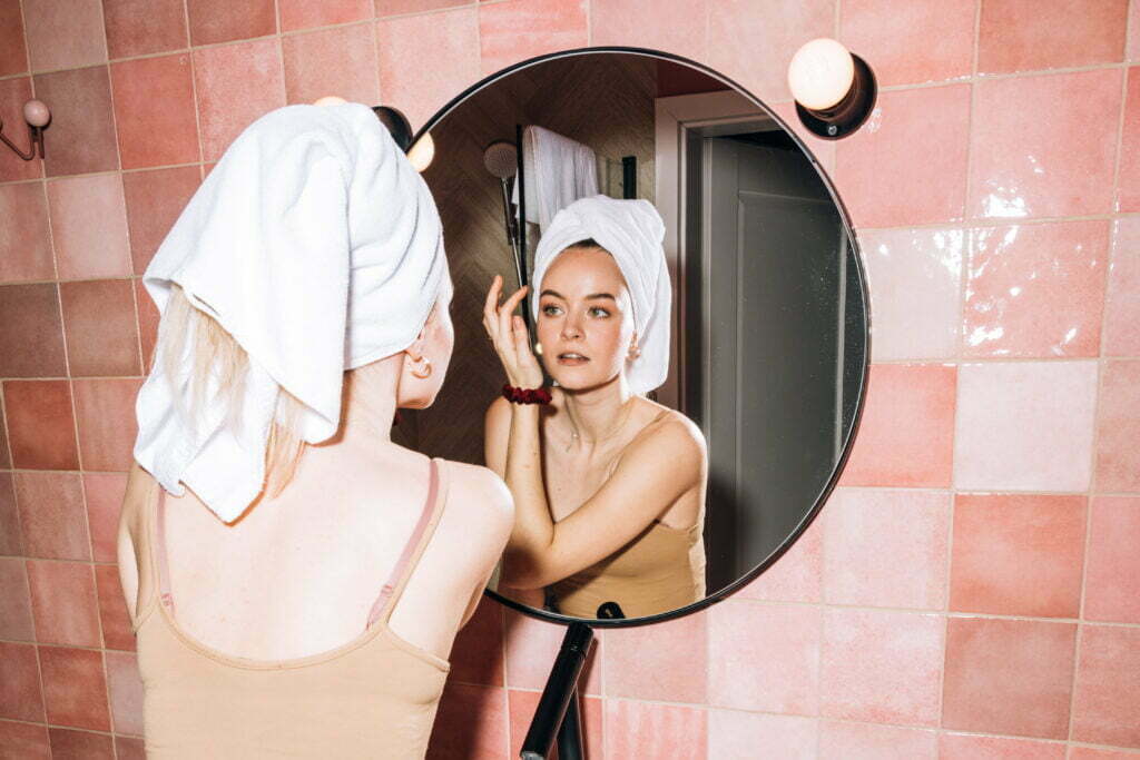 Young woman doing her facial skin care